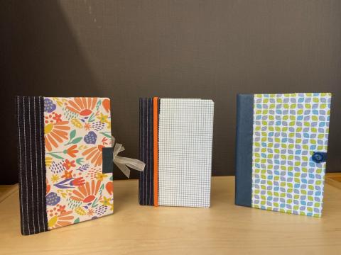 Three books made from recycled materials