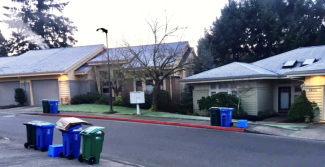 Trash and recycle bins along River Ridge