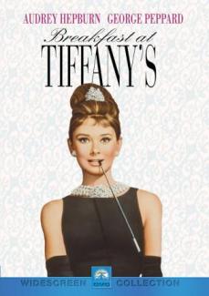 Audrey Hepburn as Holly Golightly in a sleeveless black dress with black gloves, a cigarette holder, and pearls. 