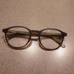 Dark Gray Rimmed Glasses by Penguin found in Health Center