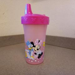 Pink plastic Disney sippy cup.