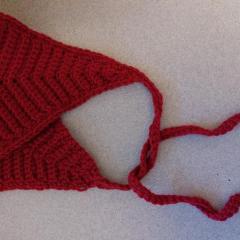 Red crocheted bonnet found at the 2nd floor Manor elevator.