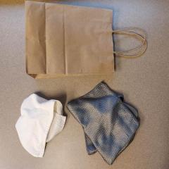 Sage green napkin and small, white towel found in the Terrace Auditorium.