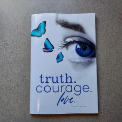 Book: Truth. Courage. Love. found in the Manor by the newpaper table.