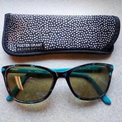 Multi color Guess sunglasses with Foster Grant case found at the North Point front entrance.