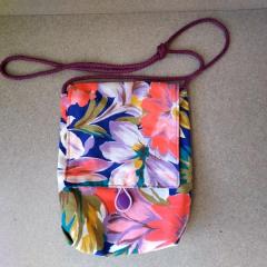 Small floral purse found in the Blue Heron Auditorium after choir rehearsal.