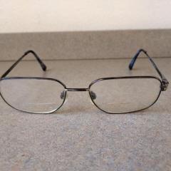 Silver Rimmed Bi-Focals.