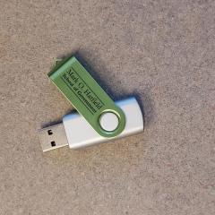 Green and grey thumb drive with Mark O Hatfield Logo found near NP copy machine.