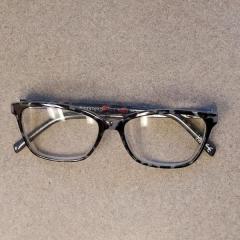 Foster Grant black and grey reading glasses found near Elk Rock Restaurant.