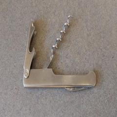 Silver metal wine key and bottle opener found in Riverview.