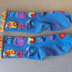 Blue socks with colorful cats found in Riverview.