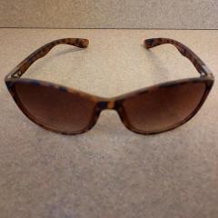 Sunglasses: women's brown and black found in the parking lot.