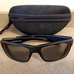 Men's "TwoFace" black sunglasses with case found in the parking lot between the Plaza & Health Center.