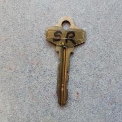 Key: single gold key with SR initials found on the lower level of the Manor.