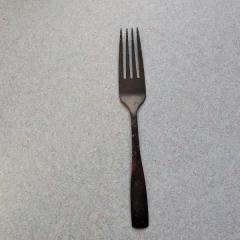 Black metal fork found in a WV cart.