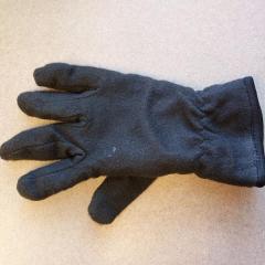 One black fleece glove.