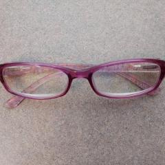 Pink reading glasses.