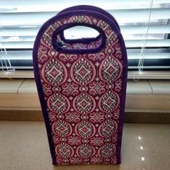 Purple and teal patterned insulated wine bag, holds 2 bottles.