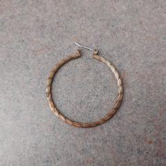 Large round gold hoop earring found outside North Point on the north side of the building by garage entry door.