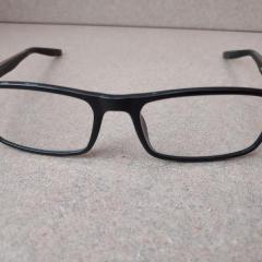 Nike black plastic prescription glasses left on Manor Reception counter.