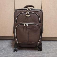 Brown Dockers rolling suitcase left in the Blue Heron Auditorium.