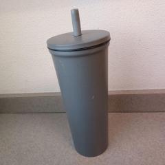 Dark grey metal water bottle left at the Manor Reception Desk.