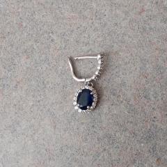 Oval sapphire earring with diamonds found in the Manor stairwell.