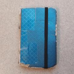 Small blue notebook.