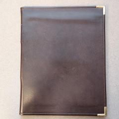 Brown leather legal pad sized folder found in the recycle room.