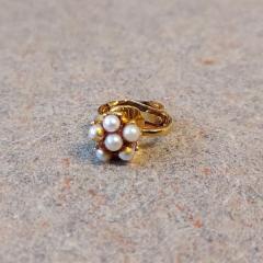 Multi pearl clip on earring found by Manor bulletin boards.
