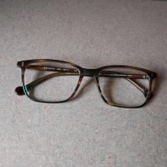 Brown plastic Eye Os Eyewear reading glasses, style: Maverick left at the Troseths!