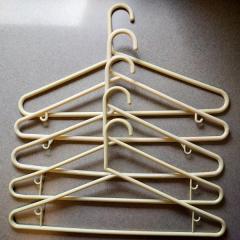 Five beige hangers found in the Manor Library.