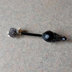Black beaded clip on earring found outside the Pantry.