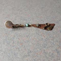 Metal triangle shaped clip on earring with bead.