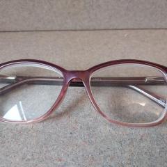 Pink Foster Grant reading glasses.