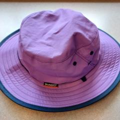 Purple sun hat with black trim by "Sunday Afternoons".