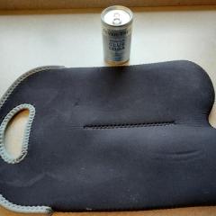 Double black with grey trim, insulated wine carrier with a can of club soda. 