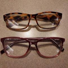 Two pairs of reading glasses (Rose & Black/Brown) found in the Gallery.