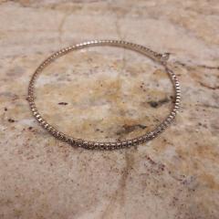 Large "diamond" hoop earing found in the Manor parking lot.