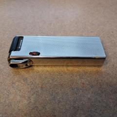 Large silver lighter found outside the Manor recycle room.