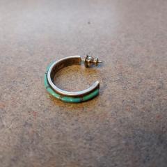 Turquoise hoop earring found in Terrace hallway.