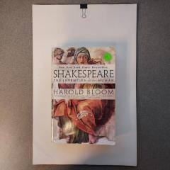 Shakespeare paperback book and stack of 11x17 cream paper left on the Manor side counter.