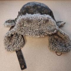 Baily Brand light and dark grey winter hat with ear flaps found on the Manor 4th floor.