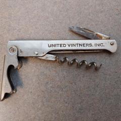 United Vinters silver wine key & bottle opener.
