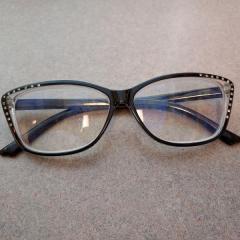 Black rimmed cat eye shaped reading glasses with jewels found in the Terrace.