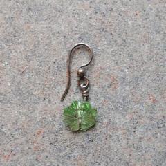Green crystal flower earring found at the Manor.
