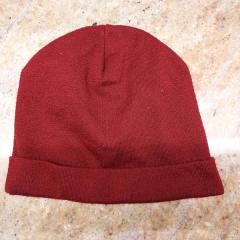 Burgundy winter hat found in the Meditation Room.