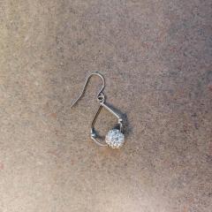Silver drop earring with sparkly ball found in the Court/Terrace hallway.