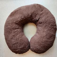 Dark brown neck pillow found at the Terrace.