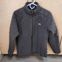 Women's black puffy jacket by Mountain Hard Wear found in a north pointe residents apartment.